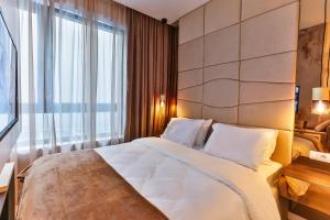 Postel nebo postele na pokoji v ubytování La Fiaba Rafailovici Apartment