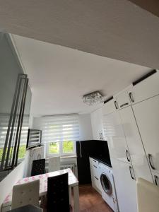 a kitchen with a table and chairs and a microwave at Alpine Retreat in Garmisch-Partenkirchen