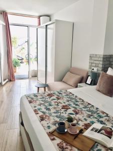 Postel nebo postele na pokoji v ubytování Apartamentos Élite - Art Collection - Frida
