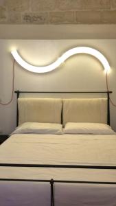 Postel nebo postele na pokoji v ubytování B&B Corte Dei Taralli
