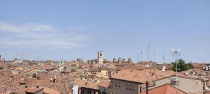 a view of a city with roofs at DIMORA AL SARACENO in Ferrara