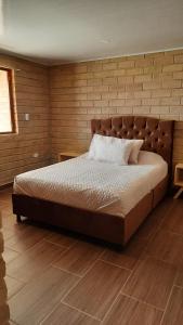 Tempat tidur dalam kamar di LOS LAGOS2