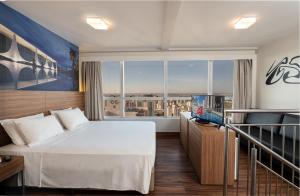 Postel nebo postele na pokoji v ubytování S4 Hotel Águas Claras