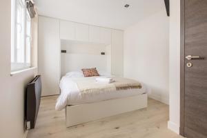 Posteľ alebo postele v izbe v ubytovaní Appartement spacieux et moderne 4 chambres à 5mn à pieds République