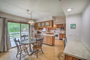 a kitchen and dining room with a table and chairs at Indiana Countryside Retreat on 37-Acre Land! in Michigan City