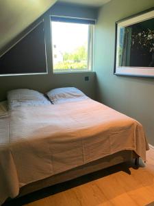 Säng eller sängar i ett rum på Trolltunga Panorama