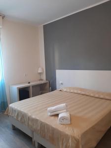 Postel nebo postele na pokoji v ubytování Mio Hotel Firenze
