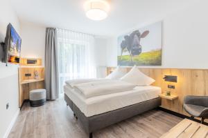 Cama ou camas em um quarto em Akzent Hotel Hoyerswege