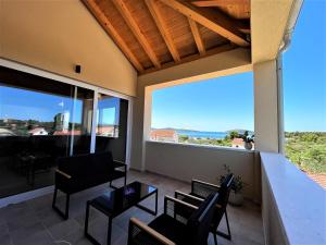 a living room with a view of the ocean at Pekasovi Seaview Apartament on a beautiful island Krapanj in Šibenik
