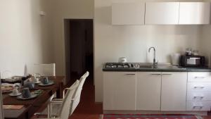 Kuchyň nebo kuchyňský kout v ubytování B&B Corte Dei Taralli
