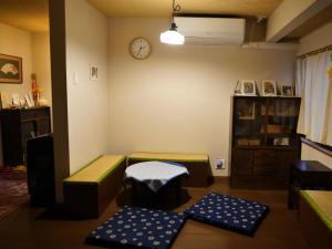Postel nebo postele na pokoji v ubytování 東山の宿 藤屋