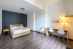 Postel nebo postele na pokoji v ubytování Sonata City Hotel