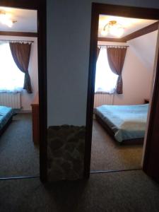 Ένα ή περισσότερα κρεβάτια σε δωμάτιο στο Dom Aga Bieszczady 10 osobowy