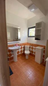 a bathroom with a toilet and a sink at VILLA HOLIDAY in Banjole