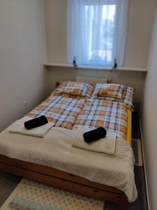 Posteľ alebo postele v izbe v ubytovaní Maja Apartman