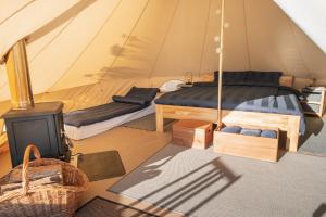 Postel nebo postele na pokoji v ubytování Mönus Paik Glamping
