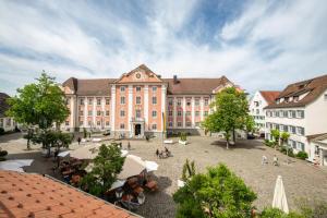 a large building with a courtyard in front of it at Gästehaus am Schlossplatz Z. 3 in Meersburg
