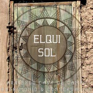 a glass door with the words elu soil on it at Elqui Sol in Vicuña