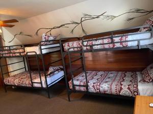 a group of bunk beds in a room at Bear Creek Resort in Big Bear Lake