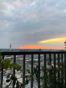 a view of a city from a balcony at sunset at Sweet Home in Milano smart district in Milan