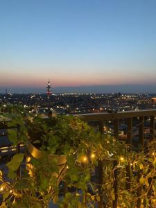 a view of a city at night with lights at Sweet Home in Milano smart district in Milan
