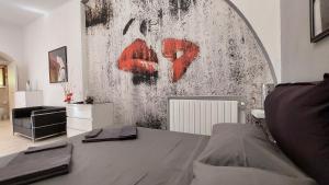 a room with a table and a painting on the wall at Chez Nous in Capoliveri