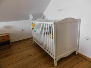 Rúm í herbergi á Apartman Lara