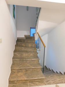 a staircase in a house with wooden floors at Apartman Lara in Otočac