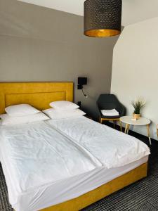 Posteľ alebo postele v izbe v ubytovaní APLIT GUEST HOUSE