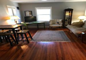 a living room with a couch and a table at The Treehouse in St Petersburg