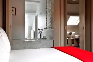 Postel nebo postele na pokoji v ubytování Hotel Julien