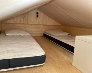 Posteľ alebo postele v izbe v ubytovaní Tiny House LA RUCHETTE