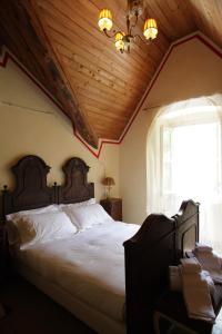 Giường trong phòng chung tại Relais Villa Brioschi