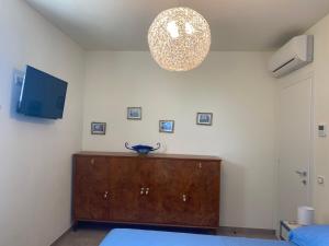 TV a/nebo společenská místnost v ubytování B&B Il Melograno