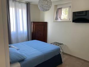 Postel nebo postele na pokoji v ubytování B&B Il Melograno