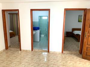 a room with two mirrors and a bathroom at Duka Apts in Sarandë +95 photos