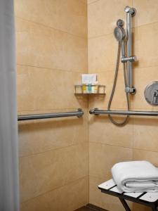 a bathroom with a shower with a towel rack at Little America Hotel Flagstaff in Flagstaff