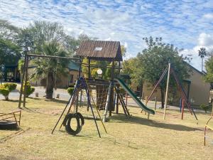 a playground with a slide and a play structure at Bela-Bela Pendleberry Grove Unit 3 in Bela-Bela