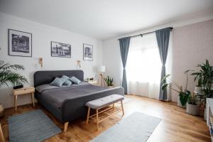 Posteľ alebo postele v izbe v ubytovaní Csendeskert Wellness Apartments - Garden, grill, chill