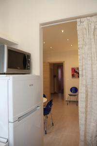 TV a/nebo společenská místnost v ubytování Appartamento Elena