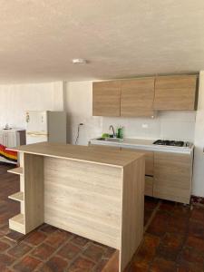 a kitchen with a counter top in a room at Casa Hostal Bellavista in Zapatoca +11 photos