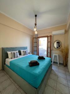 Postel nebo postele na pokoji v ubytování big house agios georgios beach naxos