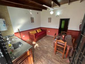 an aerial view of a living room with a red couch at El Ámbar in Colón