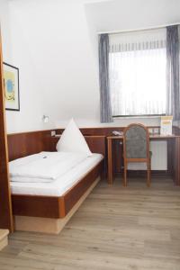 Postel nebo postele na pokoji v ubytování Hotel Bienefeld