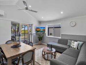 a living room with a couch and a table at Ingenia Holidays South West Rocks in South West Rocks +130 photos