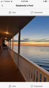 a view of the ocean from a deck of a house at Pete's Lakefront Motel, LLC in Geneva
