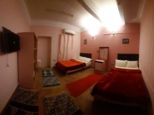 Postel nebo postele na pokoji v ubytování happy life hostel