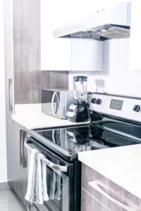 A cozinha ou cozinha compacta de Lujoso y acogedor condominio ejecutivo/familiar