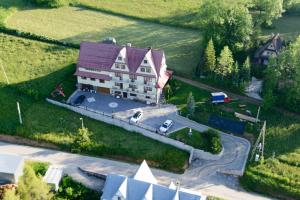 an aerial view of a large house on a road at Ośrodek Wczasowy Panorama in Bukowina Tatrzańska