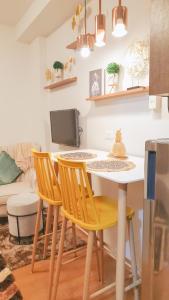 a kitchen with a table and chairs in a room at LFCM Condo Home @ Mesatierra Residences Davao City in Davao City